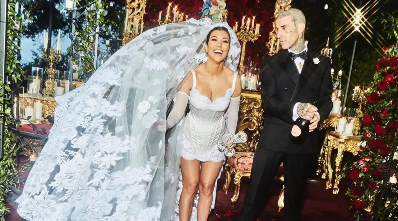 Kourtney Kardashian
Kourtney Kardashian at the Castello Brown in Portofino wearing a short D&amp;G lace mini dress with a cathedral length virgin mary embroidered veil. Three weddings, zero floor-length gowns